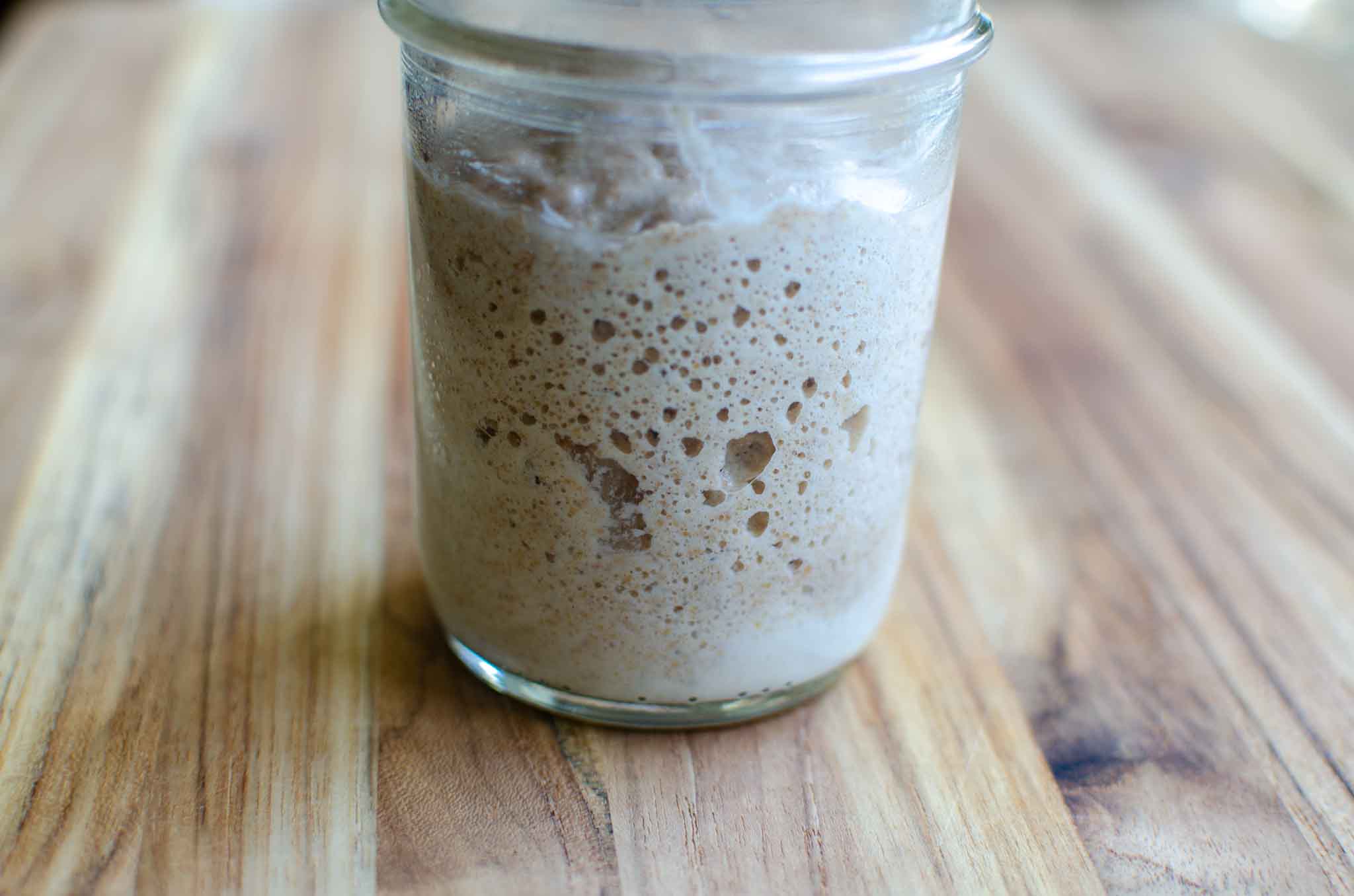 Mason jar of whole wheat sourdough starter