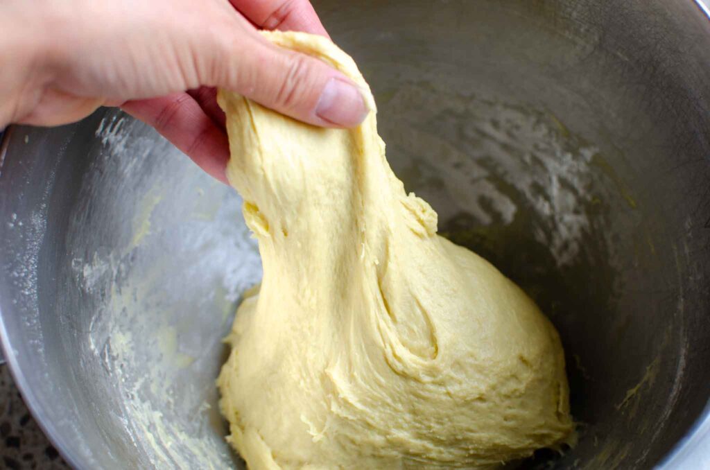 stretching the bread dough up