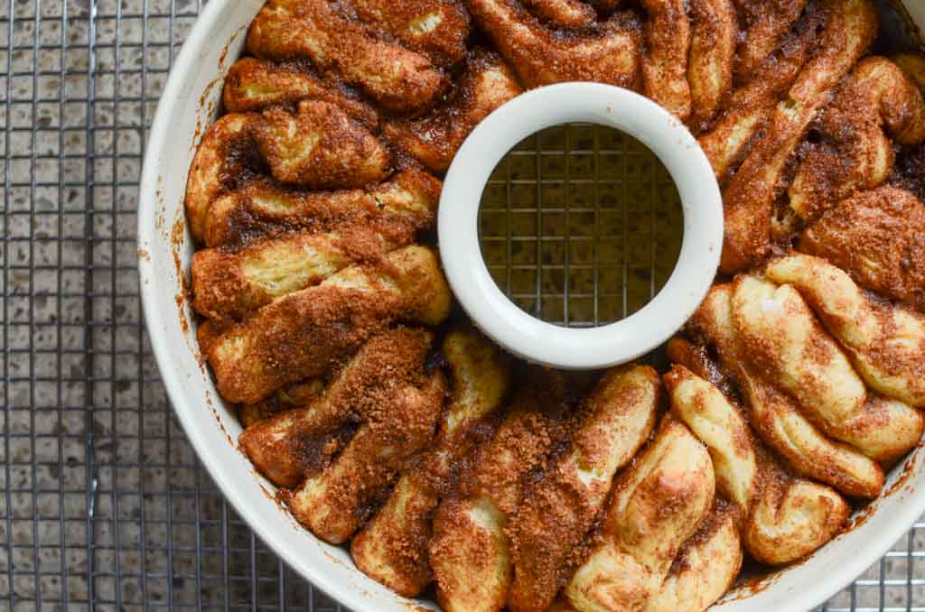 baked sourdough cinnamon sugar pull-apart bread in a circular pan