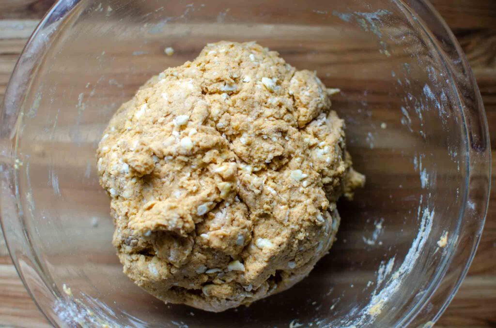 sourdough pumpkin scone dough in glass bowl