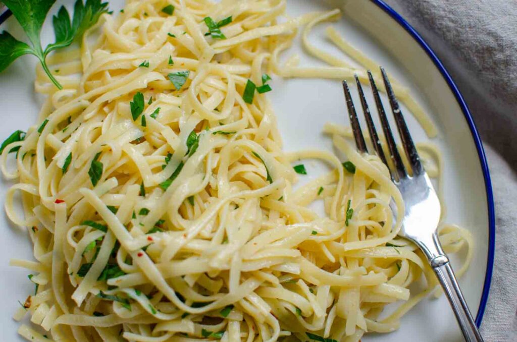 pasta aglio e olio on a plate with a fork