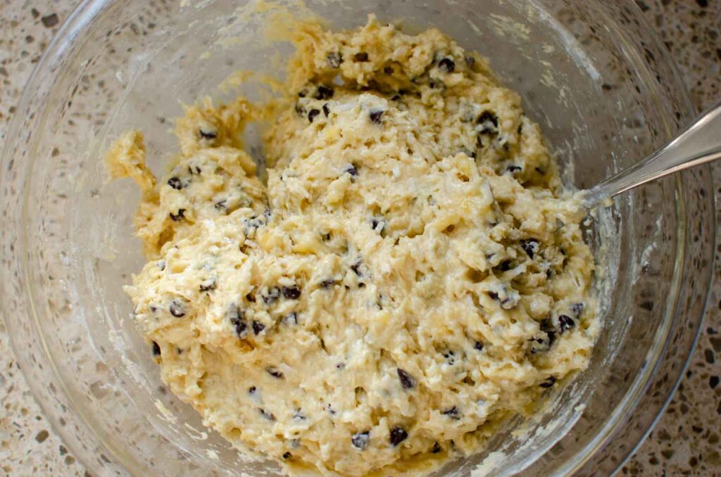 sourdough banana coconut chocolate chip muffin batter in a glass bowl