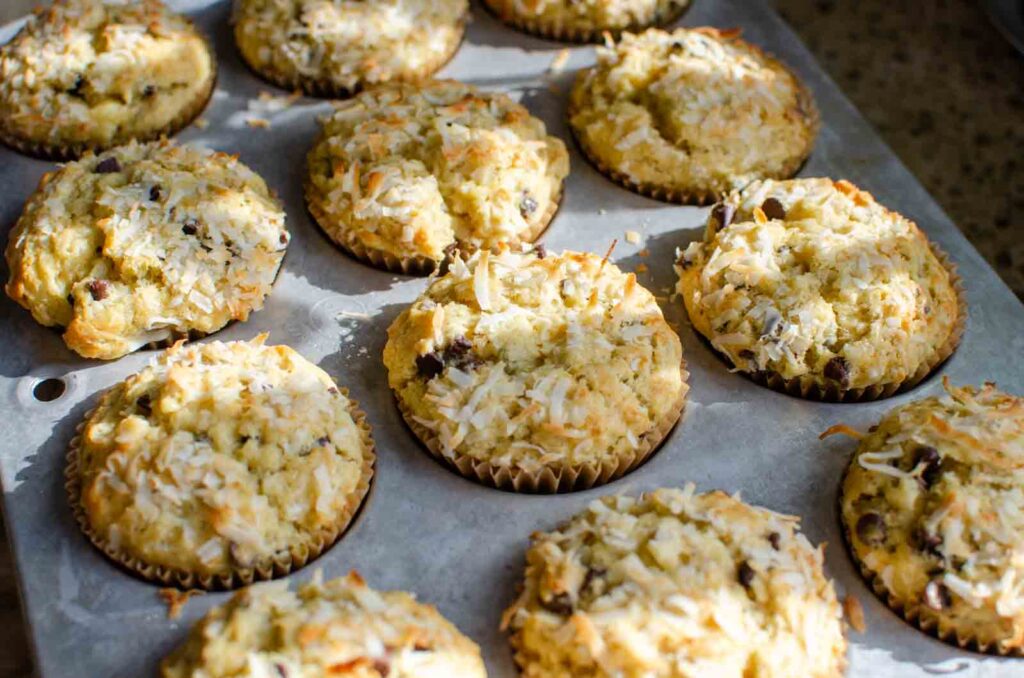 sourdough banana coconut chocolate chip muffins in muffin pan