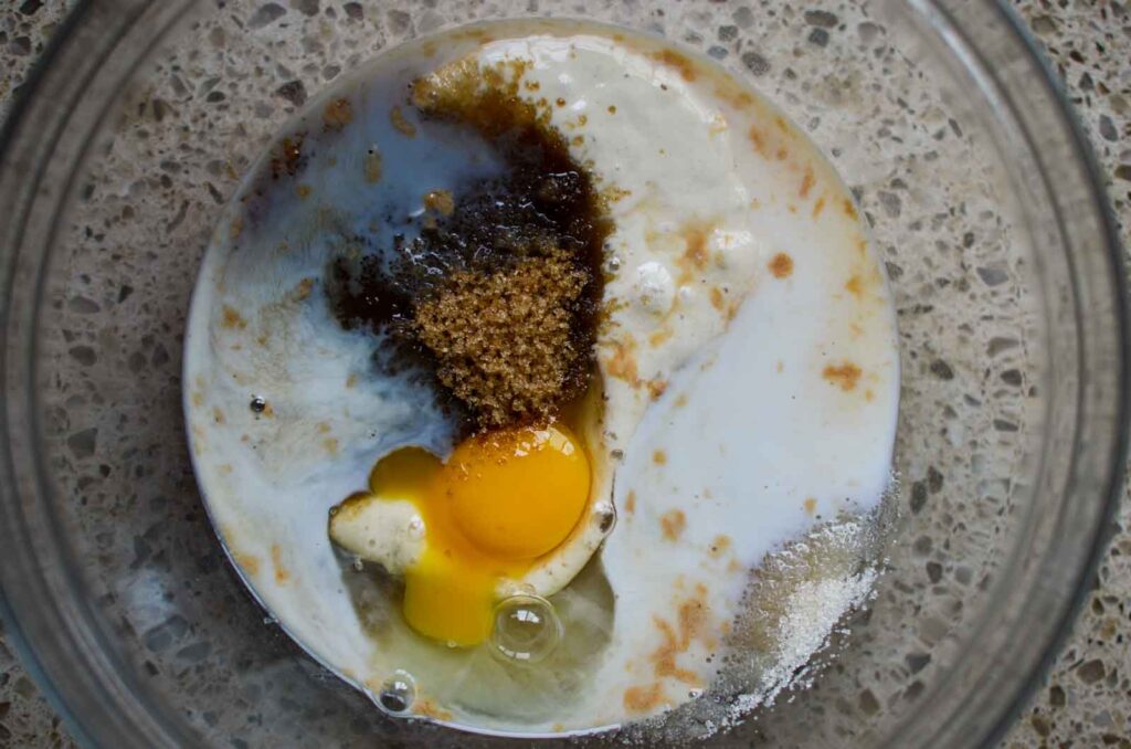 wet ingredients in a glass mixing bowl