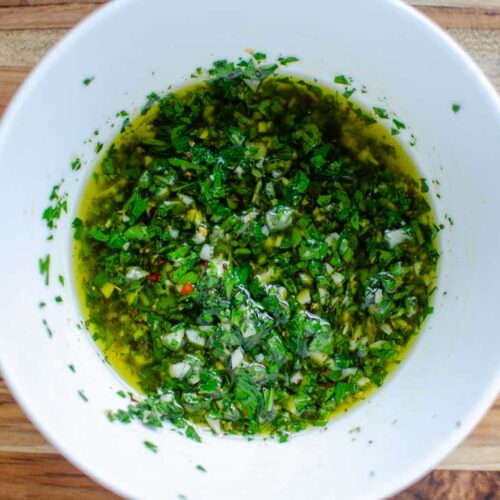 chimichurri sauce in a white bowl