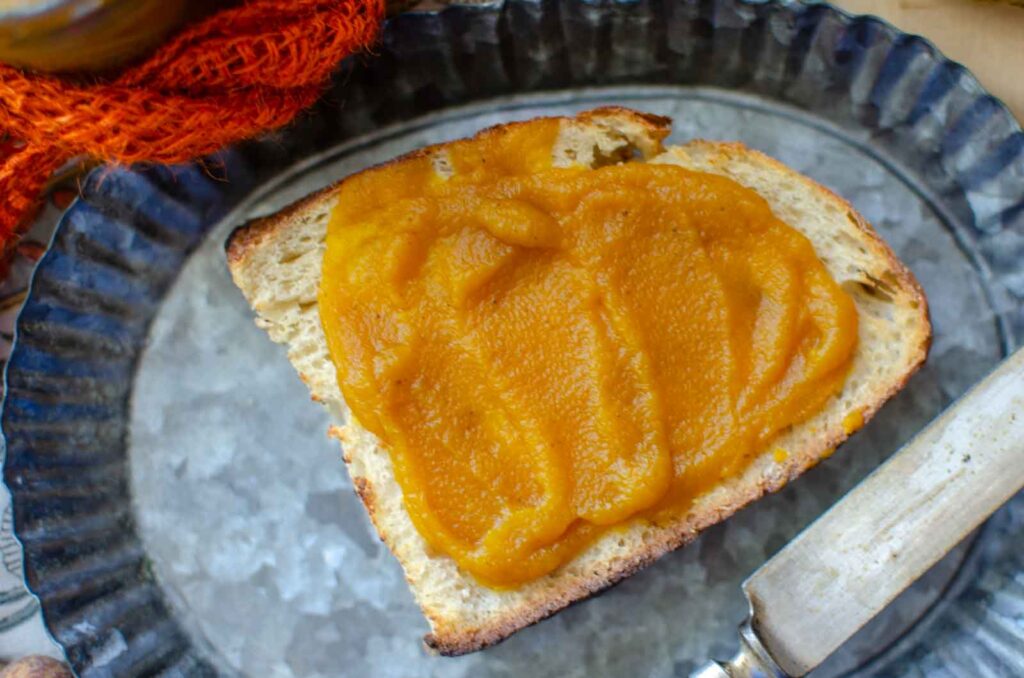 Maple bourbon pumpkin butter on a piece of sourdough toast