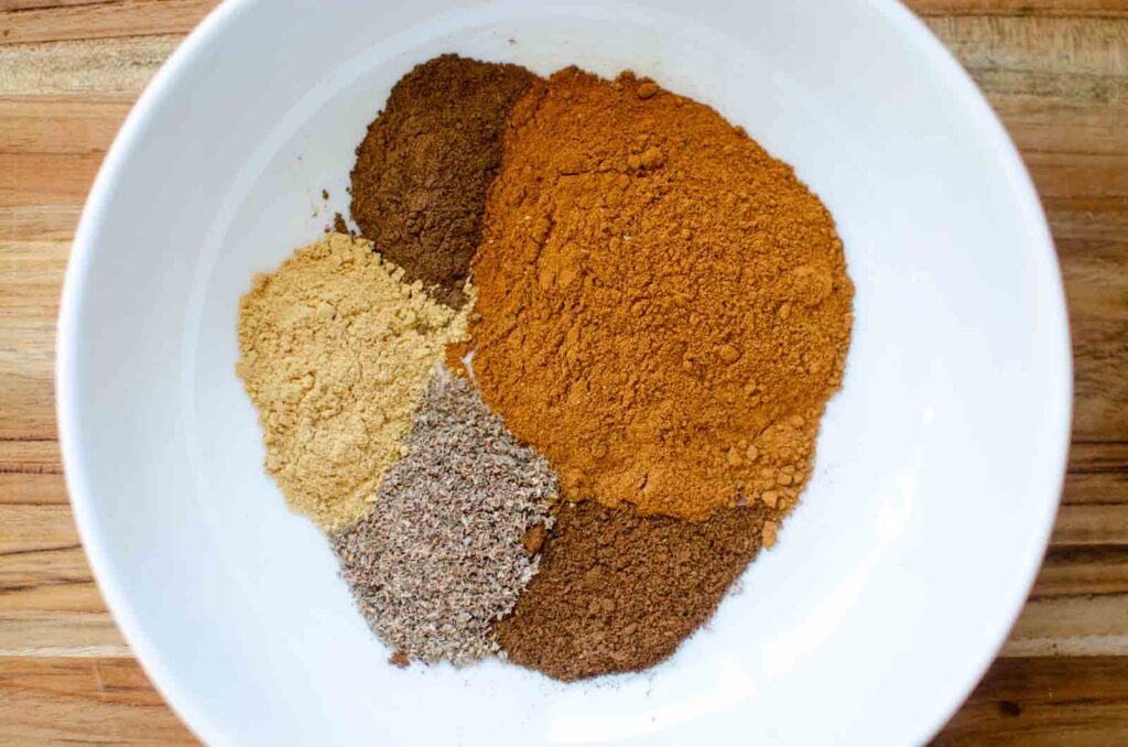 individual spices in a bowl for pumpkin pie spice blend