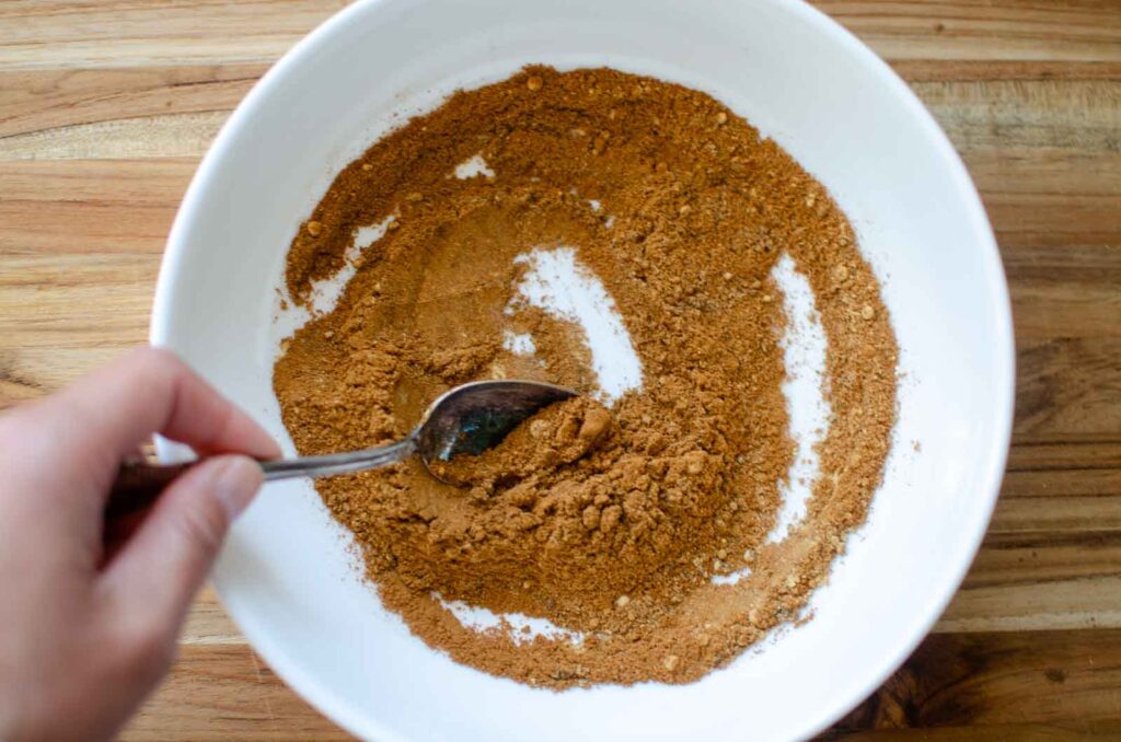 mixing spices with a spoon