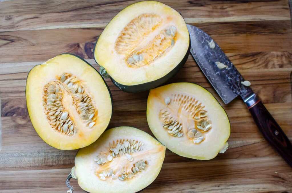 acorn squash halves on cutting board