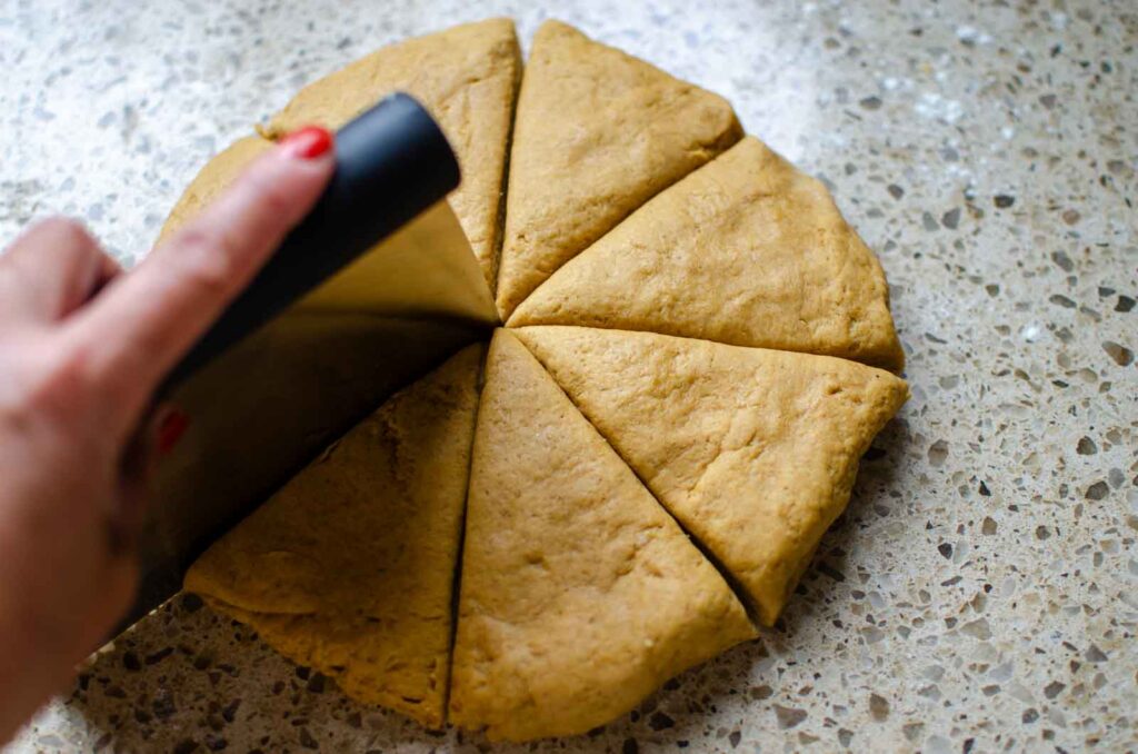 cutting sourdough gingerbread scones into wedges