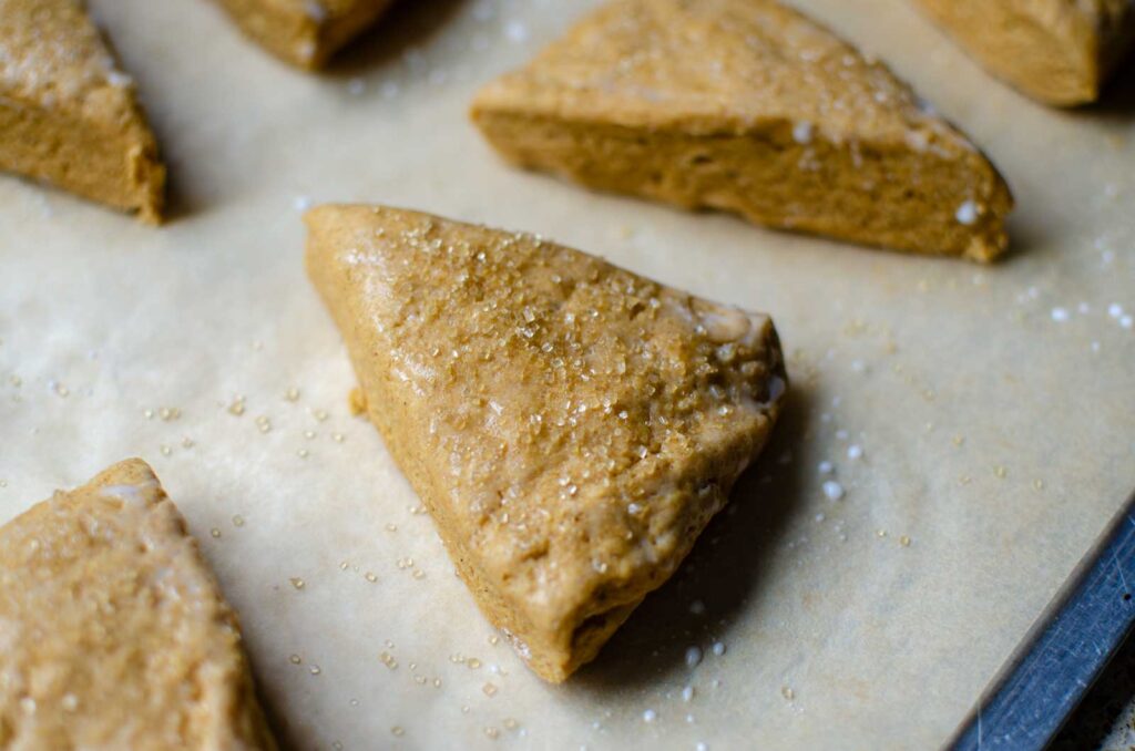 Unbaked scones on parchment lined baking sheet