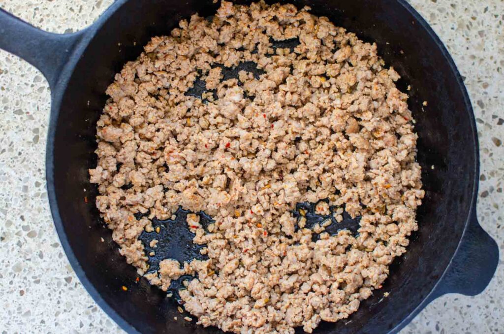 ground Italian sausage in cast iron skillet