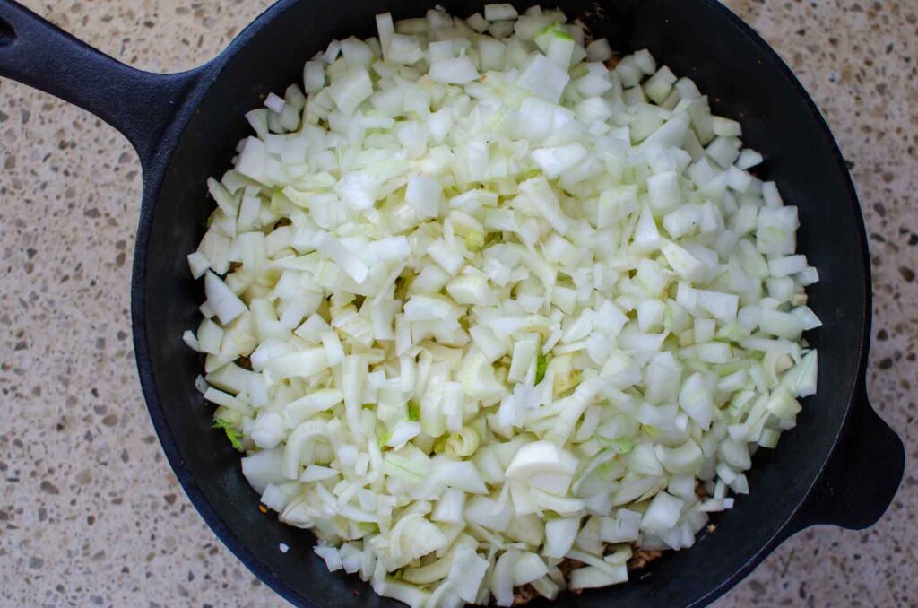 diced fennel and onion in cast iron skillet