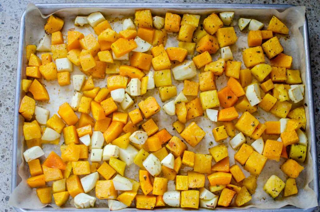 roasted squash and apples on a baking sheet