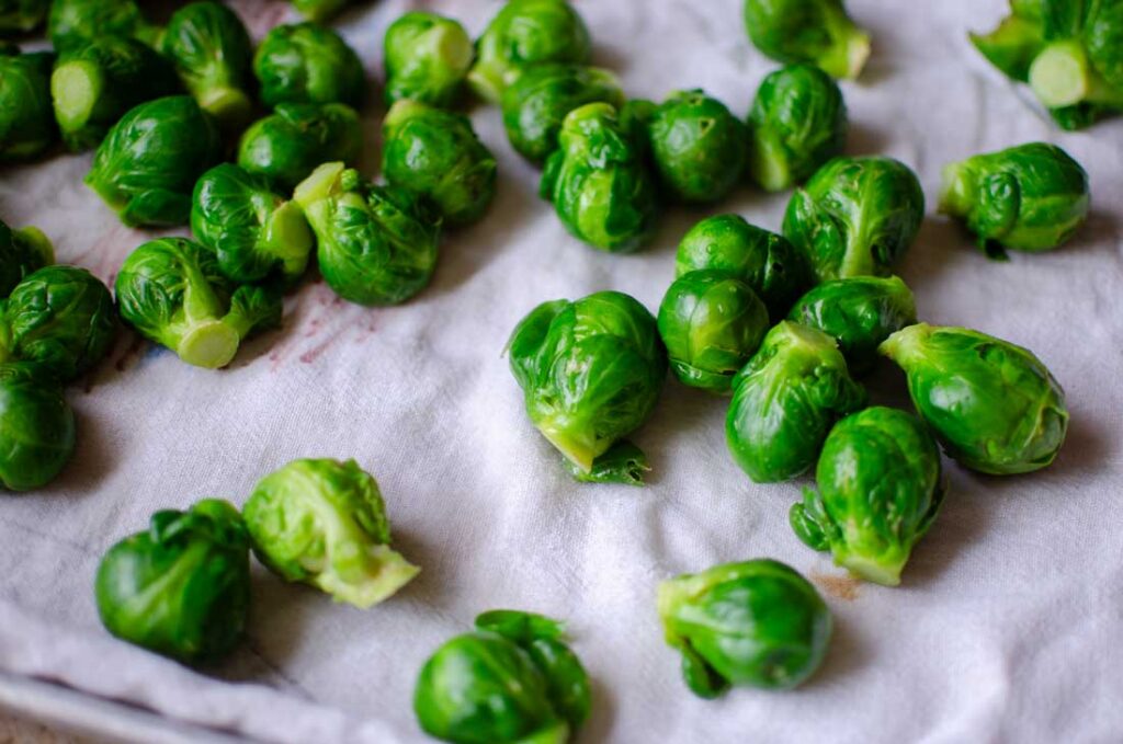 blanched brussels sprouts in a towel to dry 