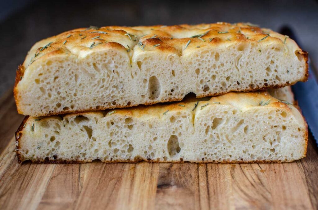 slices of sourdough discard focaccia bread stacked on one another