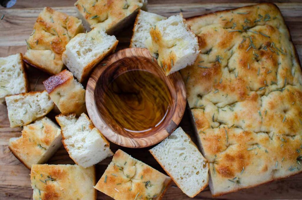 focaccia pieces with a small bowl of olive oil