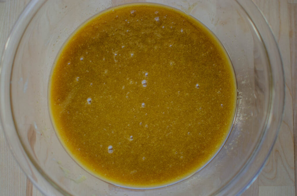 Wet ingredients for sourdough cookies in glass bowl