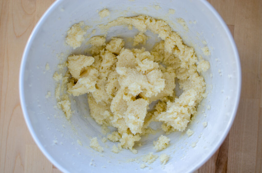 creaming butter and sugar together in white bowl