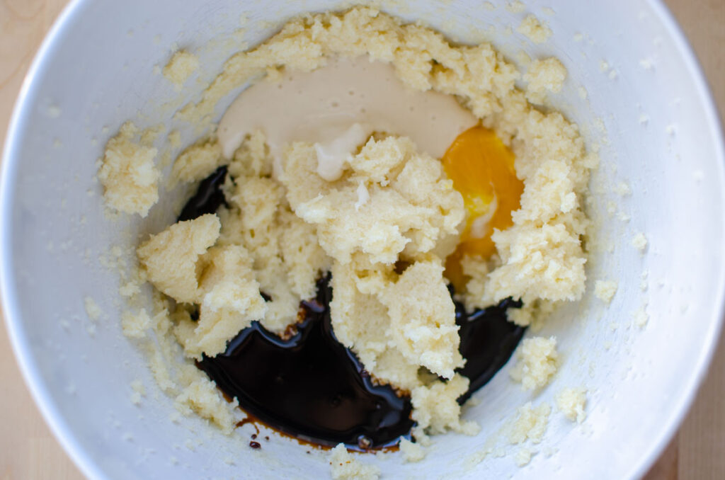 Adding the remaining wet ingredients to the bowl