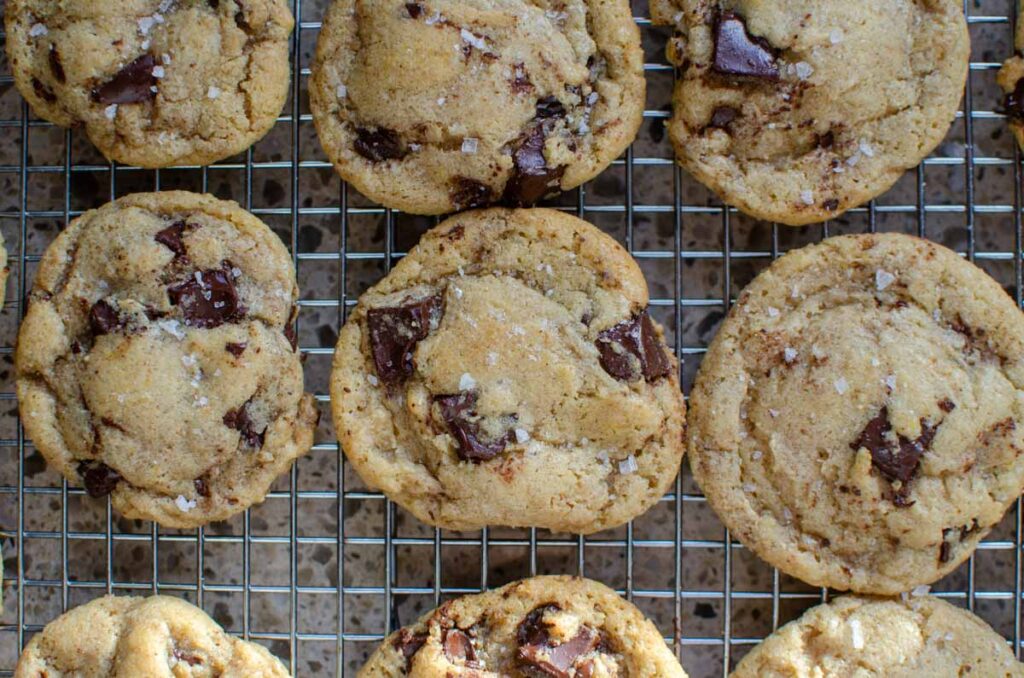 sourdough chocolate chip cookies on a wire rack