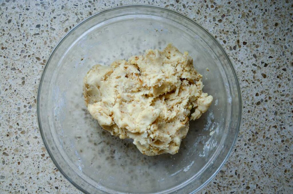 sourdough Russian tea cake cookie dough in a glass mixing bowl