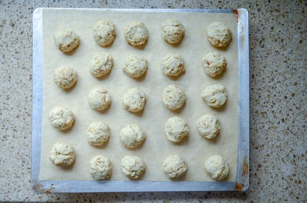 baked sourdough cookie dough balls on baking sheet