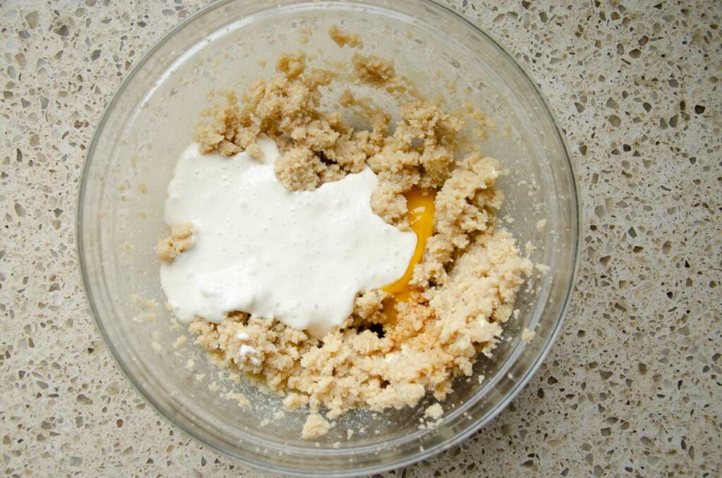 adding wet ingredients for sourdough chocolate chip cookie dough