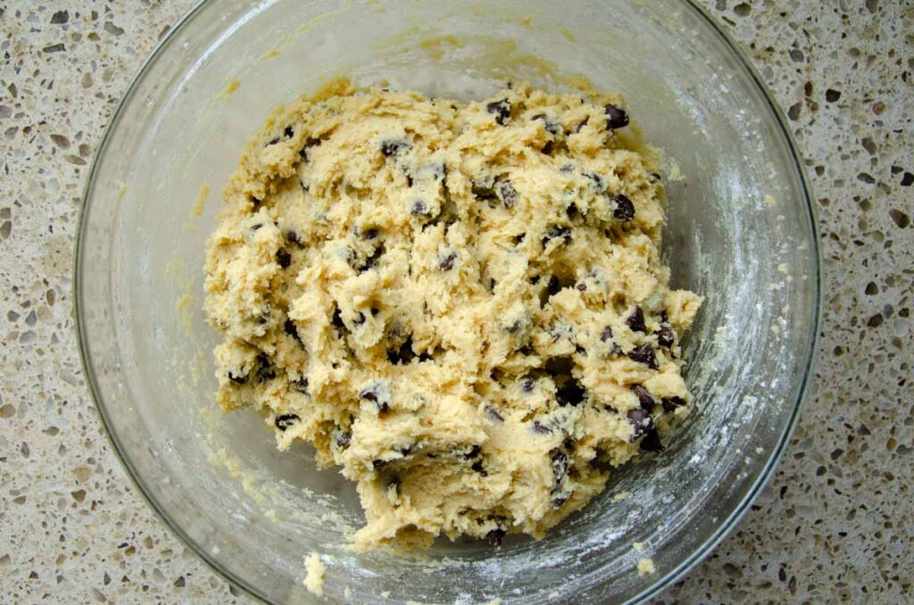 sourdough chocolate chip cookie dough in a glass bowl