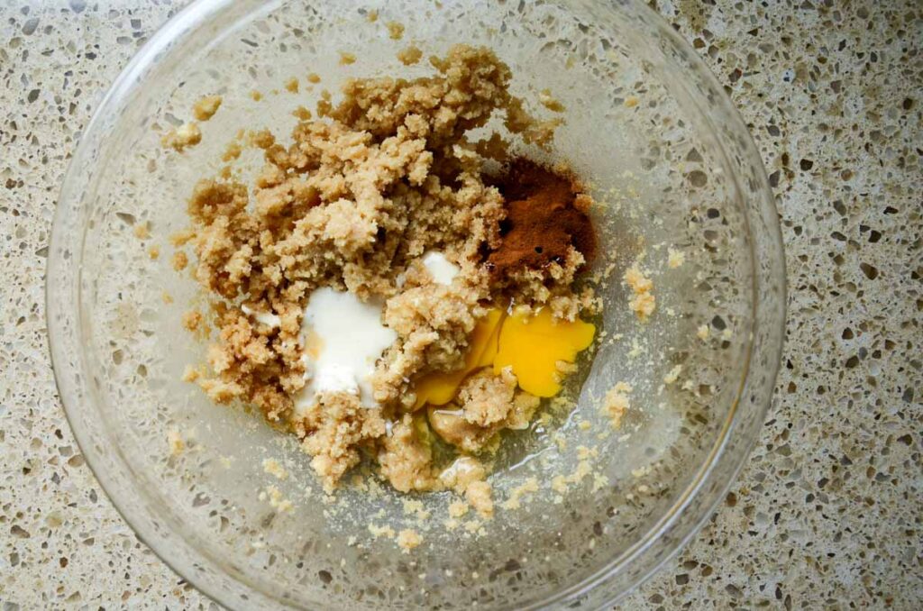 combining wet ingredients in a glass bowl