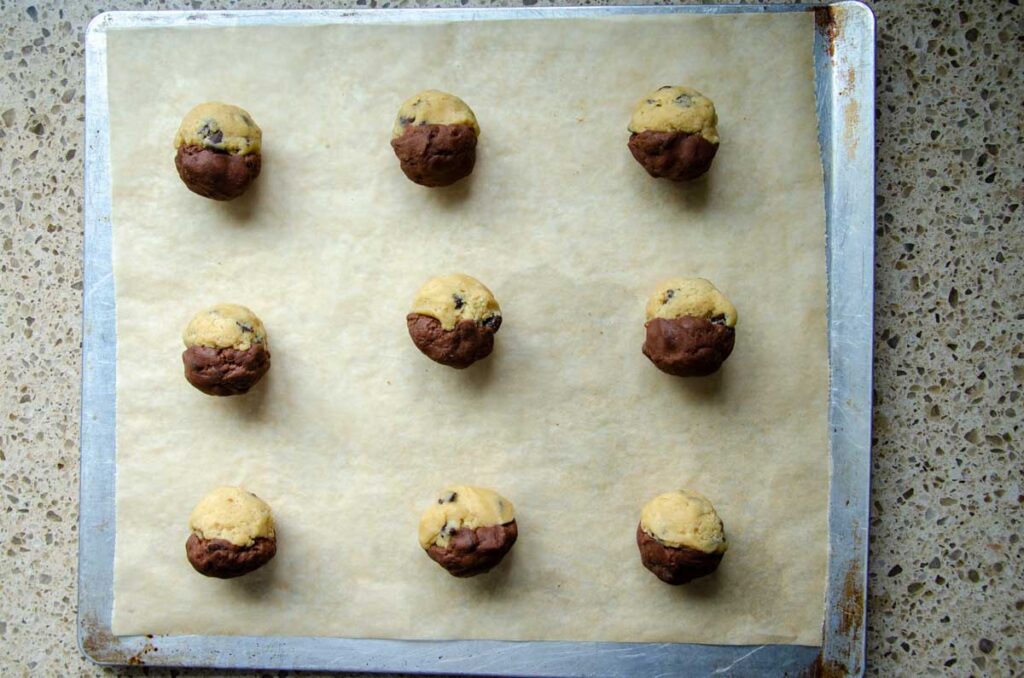 sourdough brookie dough balls on a baking sheet