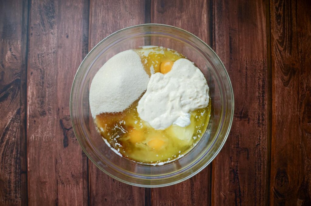 wet ingredients for sourdough chocolate chip muffins in a glass bowl