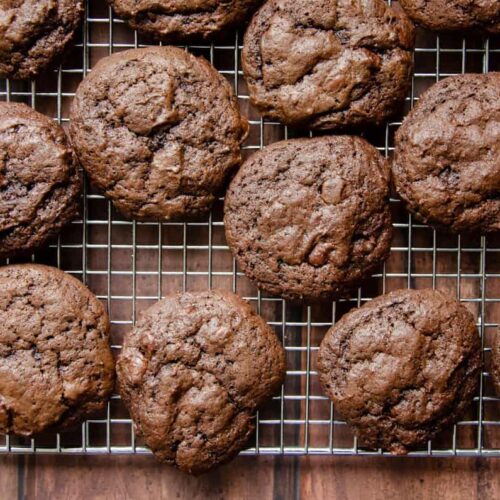 double chocolate sourdough cookies on a wire rack