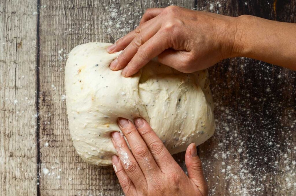 folding the side of the dough over