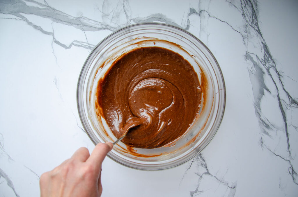 chocolate molten lava cake batter in a glass bowl