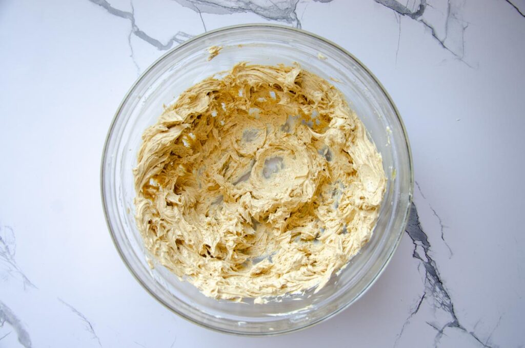 buttercream frosting with espresso powder in a bowl