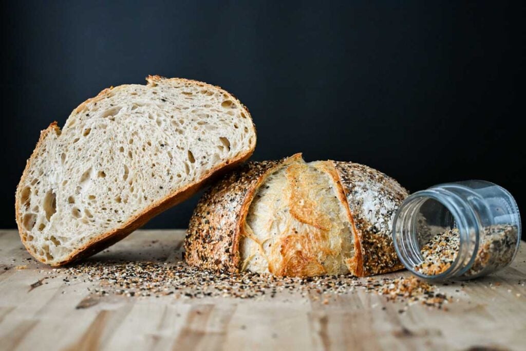 sourdough everything bagel bread loaf cut in half