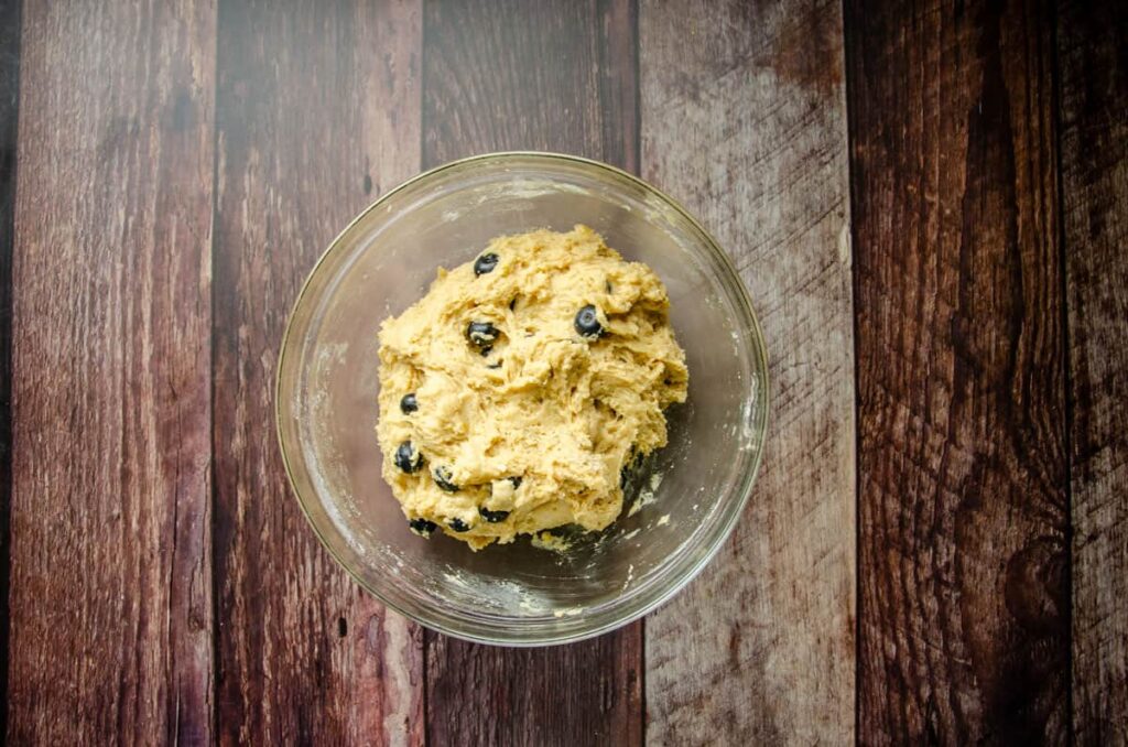 glass bowl with sourdough lemon blueberry quick bread batter