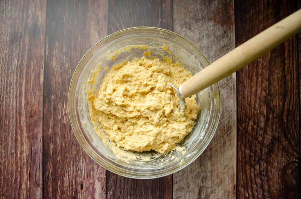 combining the ingredients in a glass bowl with a Danish dough whisk