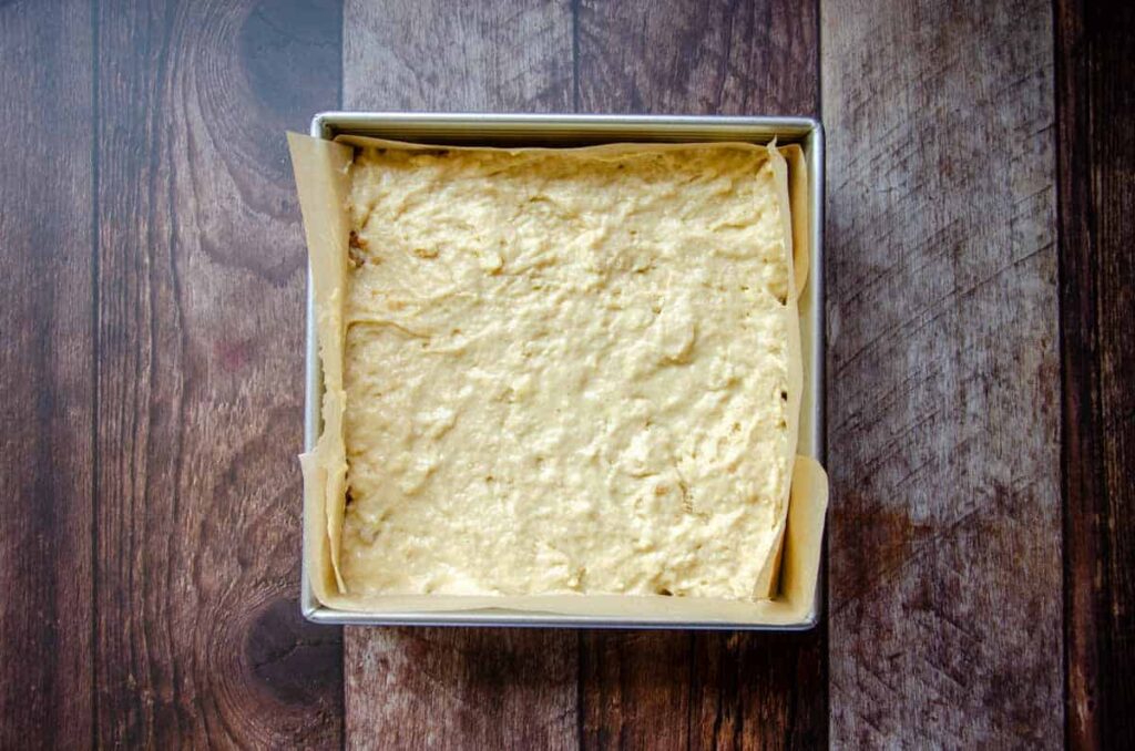 adding a second layer of sourdough coffee cake batter