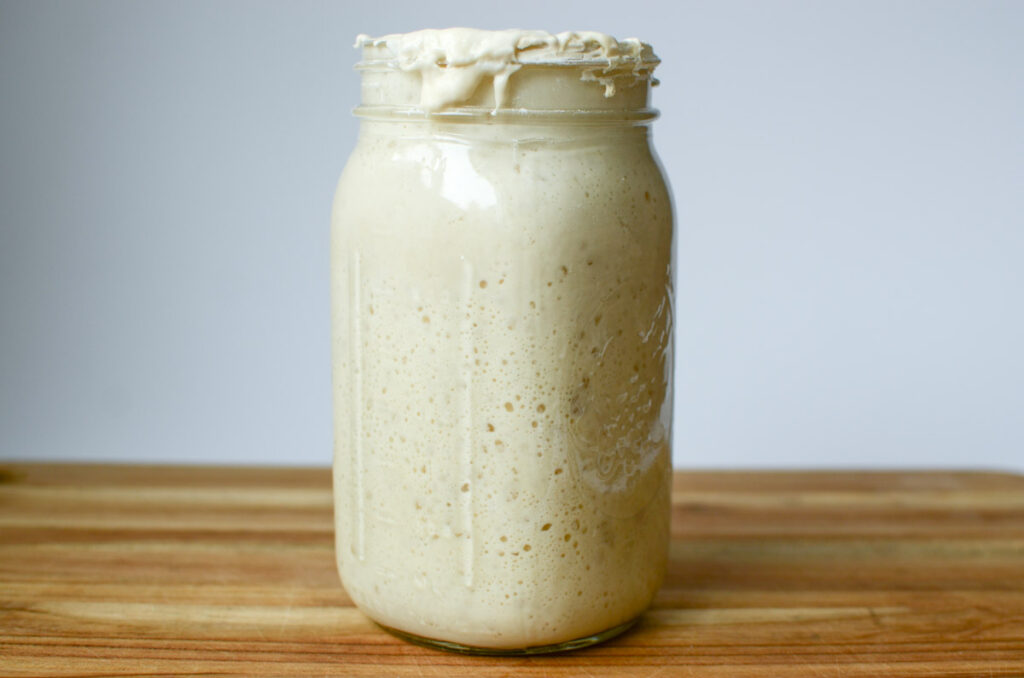 a sourdough starter in a glass mason jar