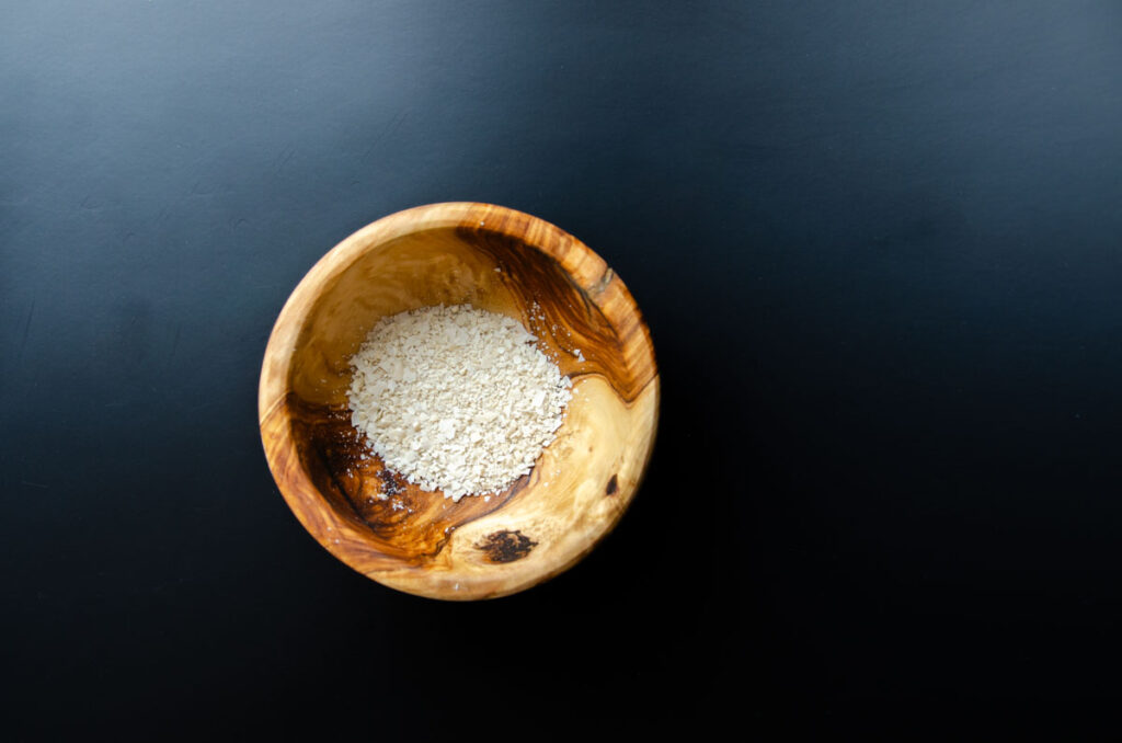 powdered dried sourdough starter in a wooden bowl