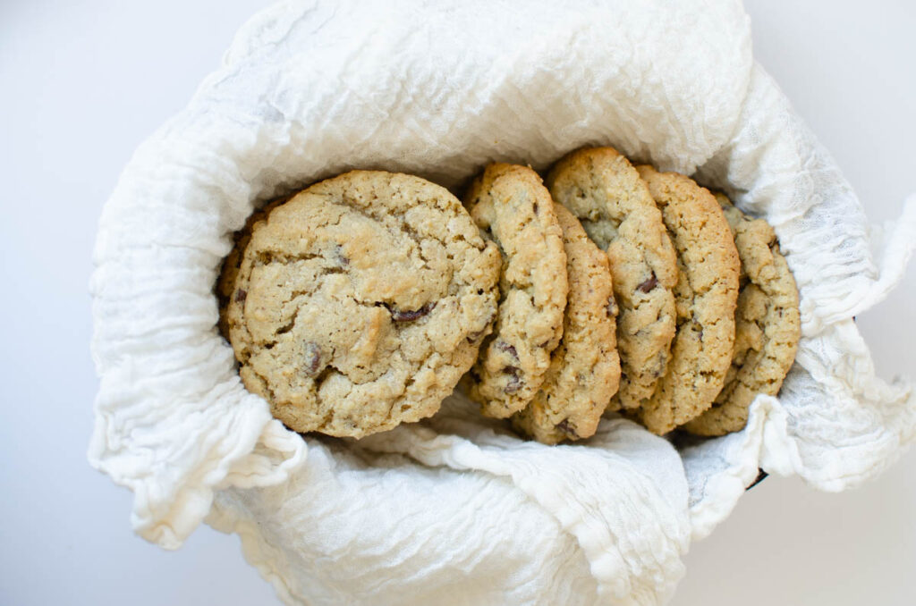 a basket of sourdough oatmeal chocolate chip cookies