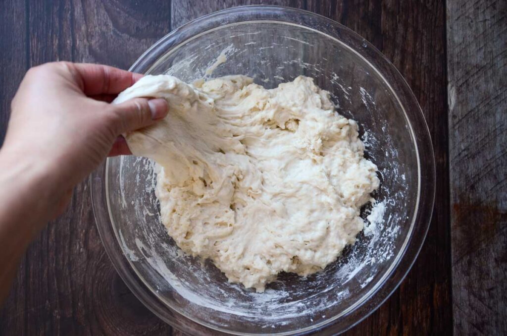 stretching the sourdough bread dough