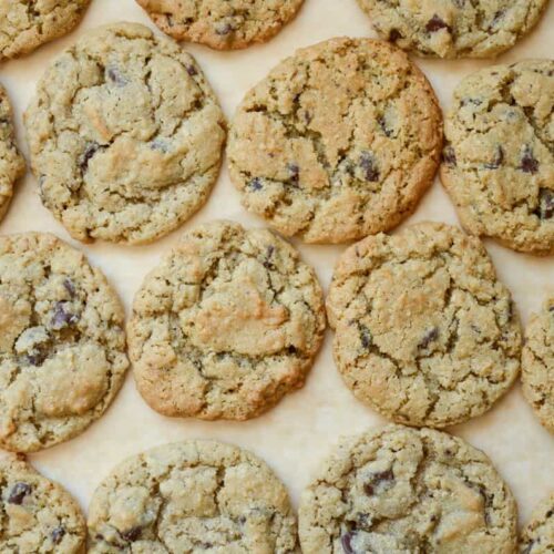 sourdough oatmeal chocolate chip cookies on a piece of parchment paper