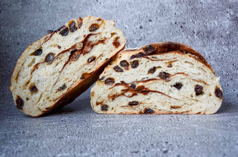 a cut loaf of cinnamon raisin sourdough bread