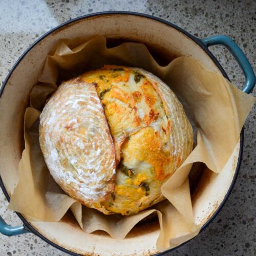 sourdough jalapeno cheddar bread in a Dutch oven