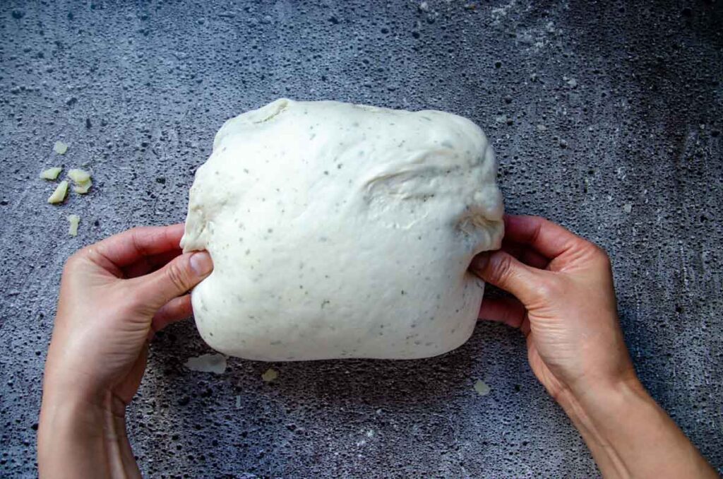 pinching bread dough ends together 