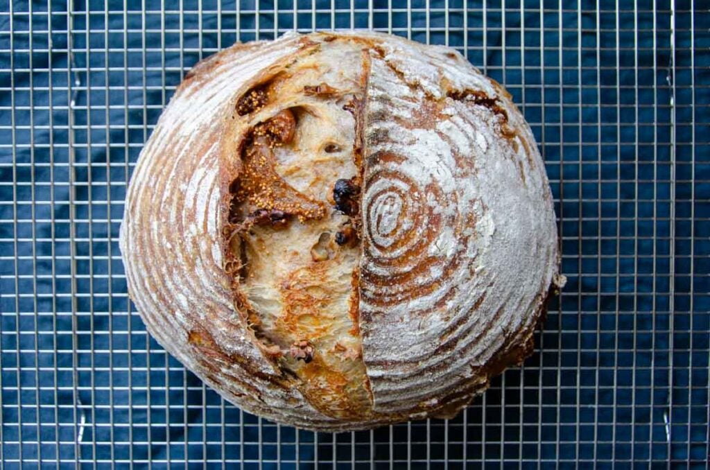 sourdough fig and walnut bread on a wire rack
