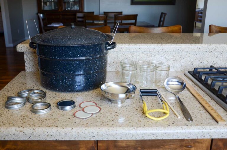 water bath canning supplies on the counter